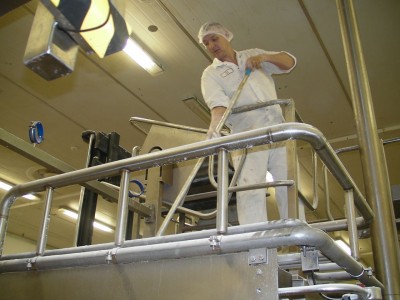 Oompa Loompa feeding a machine with raw ingredients Oompa Loompa feeding a machine with raw ingredients